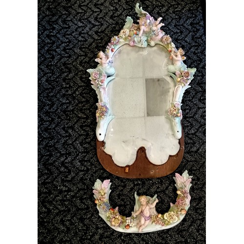 121 - Antique continental wall mirror with encrusted detail design depicting 4 cherubs with wide bevel cut... 