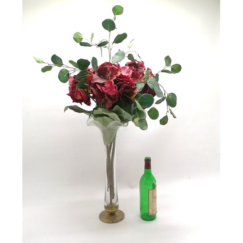143 - Large glass vase with bronze base with a display of silk flowers total height 90cm