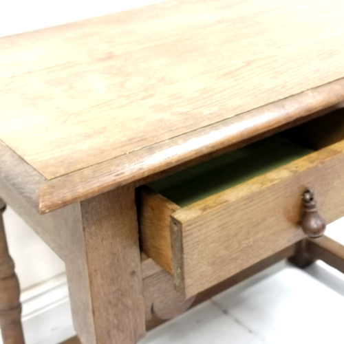 240 - Antique oak 2 drawer side table with stretcher base - has a split to the top but otherwise in good u... 