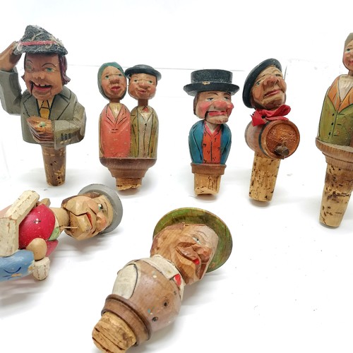 295 - 20 x novelty vintage continental carved wooden bottle stoppers - some with moving features inc kissi... 