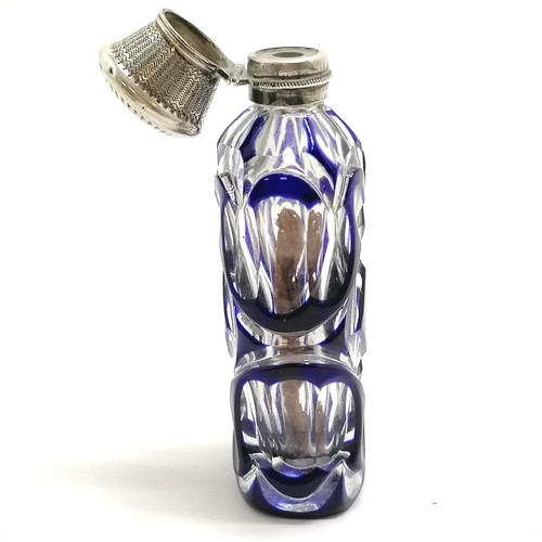 89 - Antique blue overlaid glass scent bottle with unmarked silver lid - 9.5cm ~ dents to lid, lacks stop... 