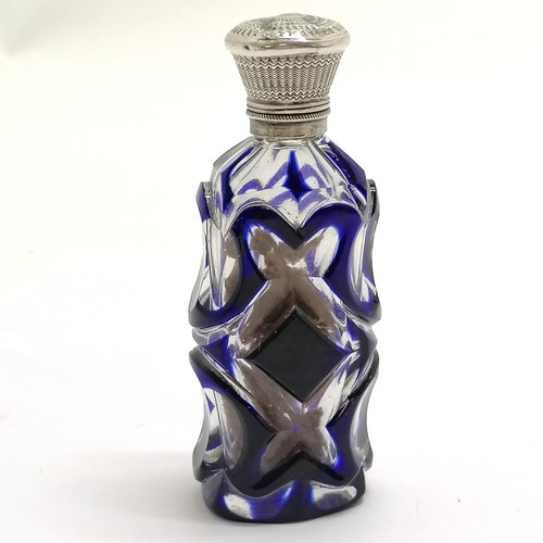 89 - Antique blue overlaid glass scent bottle with unmarked silver lid - 9.5cm ~ dents to lid, lacks stop... 