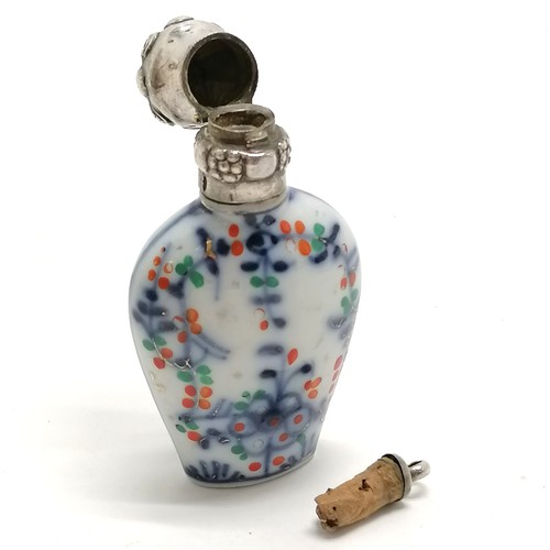 92 - Antique continental marked silver topped scent bottle with porcelain floral decorated body - 8cm & n... 