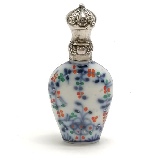 92 - Antique continental marked silver topped scent bottle with porcelain floral decorated body - 8cm & n... 