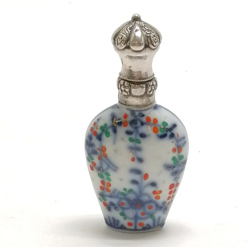 92 - Antique continental marked silver topped scent bottle with porcelain floral decorated body - 8cm & n... 