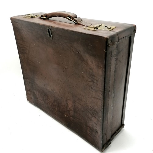 133 - Vintage brown leather unusual suitcase with brass fittings - 52cm x 45cm x 16.5cm deep and has 2 bra... 