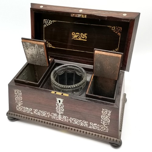 139 - Antique rosewood sarcophagus shaped tea caddy with mother of pearl decoration & original glass mixin... 