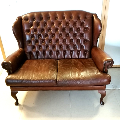 182 - Brown leather 2 seater sofa with button back detail on cabriole legs 130cm long x 85cm deep x100cm h... 