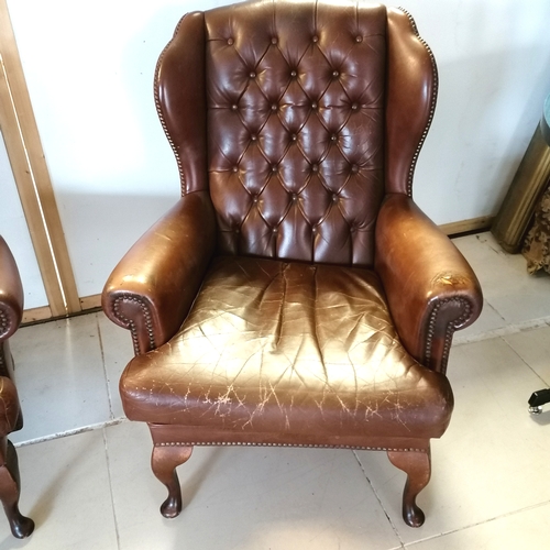 183 - Brown leather matching wing armchair with button back detail 100cm deep x 98cm high x 78cm wide - ha... 