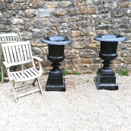 5 - Large pair of black cast iron fluted urns on stands - 36cm diameter base x 98cm high