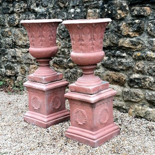 8 - Pair of pedestal urns with acanthus leaf detail on square pedestal bases with wreath detailing - in ... 