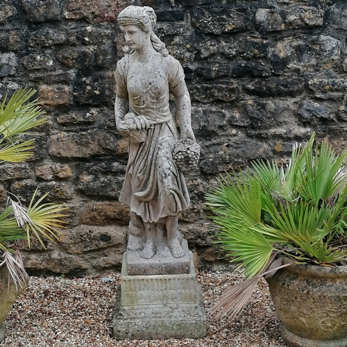 13 - Figure of a woman holding grapes on a square pedestal base - 140cm high x 40cm diameter