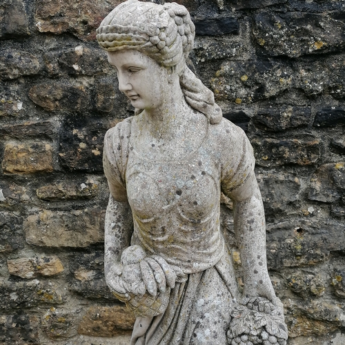 13 - Figure of a woman holding grapes on a square pedestal base - 140cm high x 40cm diameter