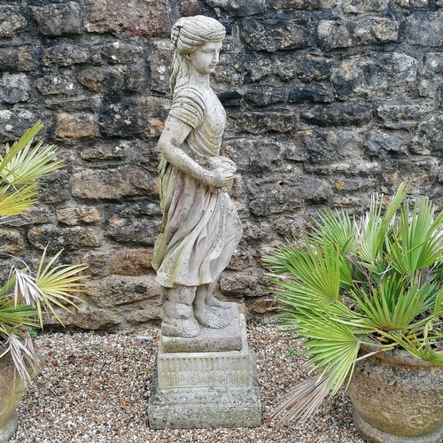 13 - Figure of a woman holding grapes on a square pedestal base - 140cm high x 40cm diameter