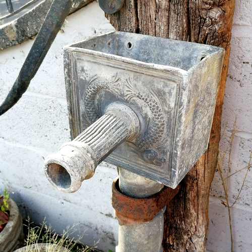 18 - Antique lead pump mounted on a board 122cm high to the top of the handle