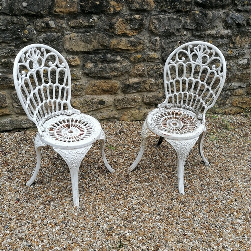 29 - Pair of white painted cast iron garden chairs - 84cm high x 36cm diameter