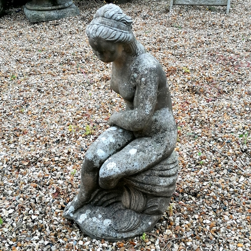 52 - Figure if a woman seated on a rock - 58cm high