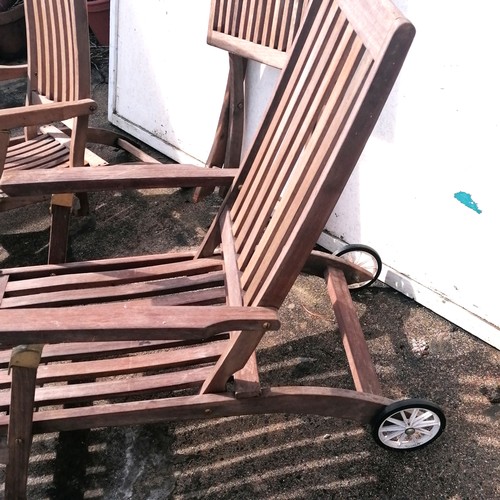 70 - 2 teak sun loungers with brass mounts (1 has wheels) T/W a teak folding chair - 106cm long x 91cm hi... 