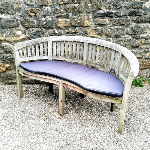 77 - Curved teak 3 seater garden bench T/W blue seat cushion - 160cm long x 55cm deep x 83cm high. In goo... 