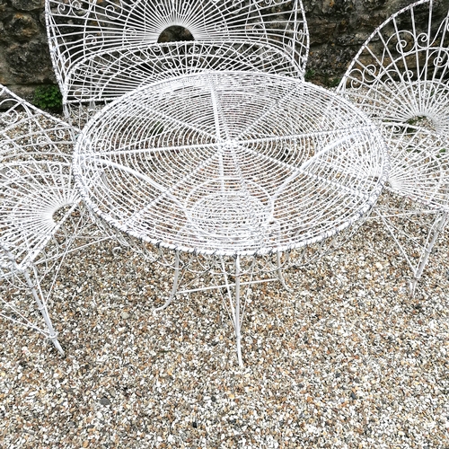 100 - Wirework garden 2 seater bench circular table and 2 armchairs - the bench has damage near the back f... 