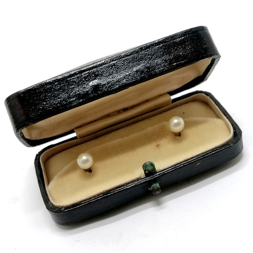 531 - Antique pair of 9ct marked gold pearl studs (1.5g total weight) in original retail box