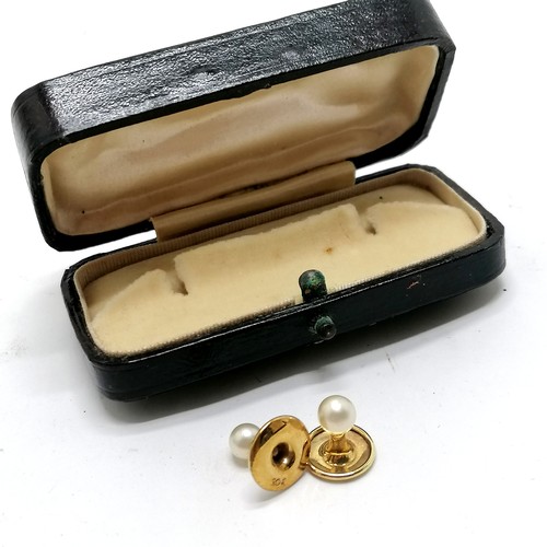 531 - Antique pair of 9ct marked gold pearl studs (1.5g total weight) in original retail box