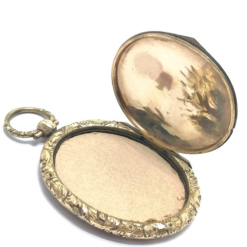 554 - Antique portrait miniature of a lady pendant with a locket reverse in a Fred Yoell (Swindon) retail ... 