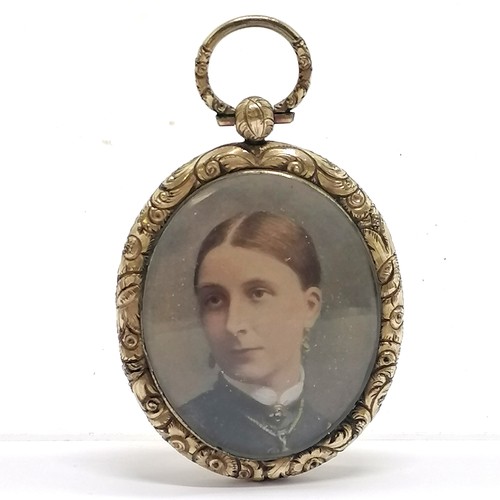 554 - Antique portrait miniature of a lady pendant with a locket reverse in a Fred Yoell (Swindon) retail ... 