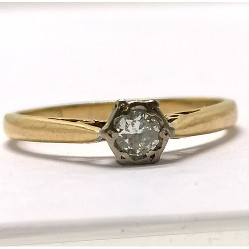 555 - 18ct hallmarked gold diamond solitaire ring with a hexagonal shaped mount - size M½ & 2.2g total wei... 