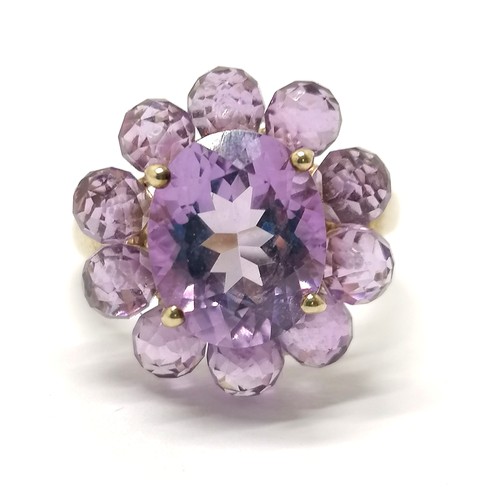 560 - 9ct hallmarked gold unusual amethyst cluster ring - the outer ring are facetted balls ~ size O½ & 3.... 