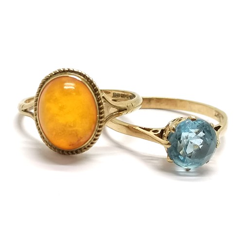 585 - 2 x 9ct gold rings (1 hallmarked, 1 marked) amber (size L) & blue stone (size N) - 3.3g total weight... 