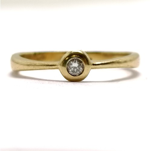 619 - 9ct hallmarked gold diamond solitaire ring with rub over mount - size Q & 2g total weight