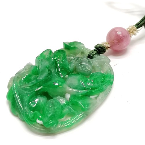 620 - Chinese hand carved green jade pendant with pierced flower / fruit detail with a pink jade bead - pe... 