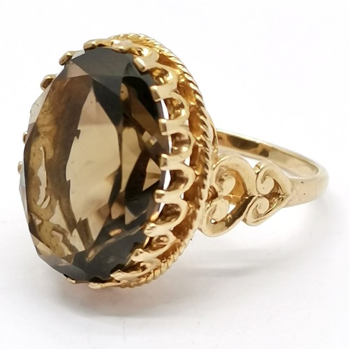 671 - 9ct hallmarked gold fancy set smoky quartz ring - size M½ & 6.7g total weight