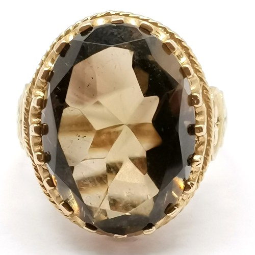 671 - 9ct hallmarked gold fancy set smoky quartz ring - size M½ & 6.7g total weight