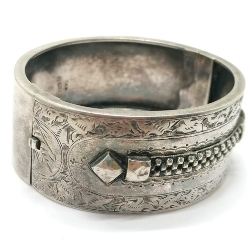 684 - 1882 antique silver hallmarked bangle with engraved & raised detail to front - 6cm across & 32g ~ ha... 