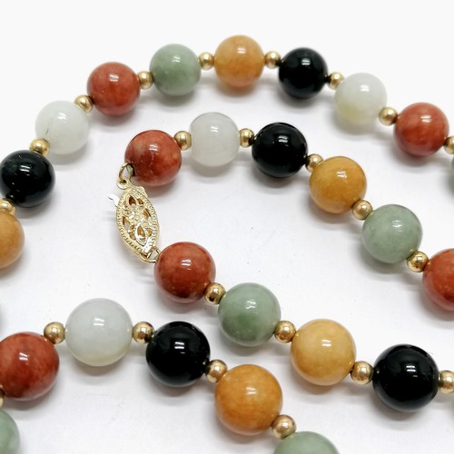 688 - Strand of multicoloured hardstone beads (inc jade) with a 14ct marked gold clasp - 60cm