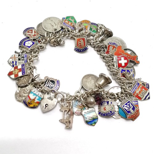 689 - Silver charm bracelet with charms inc 1762 George III 3d, shields, St Christopher etc - total weight... 