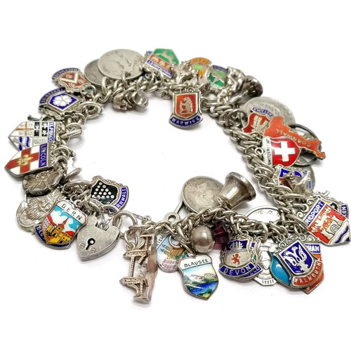 689 - Silver charm bracelet with charms inc 1762 George III 3d, shields, St Christopher etc - total weight... 