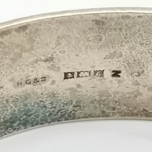 727 - Solid silver hallmarked bangle with engraved detail to front - 6cm across & 56g