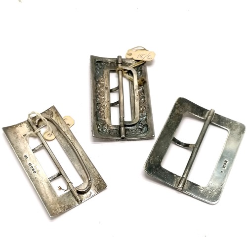 774 - 3 x antique silver buckles - embossed is unmarked & 7cm x 4cm ~ total weight 97g