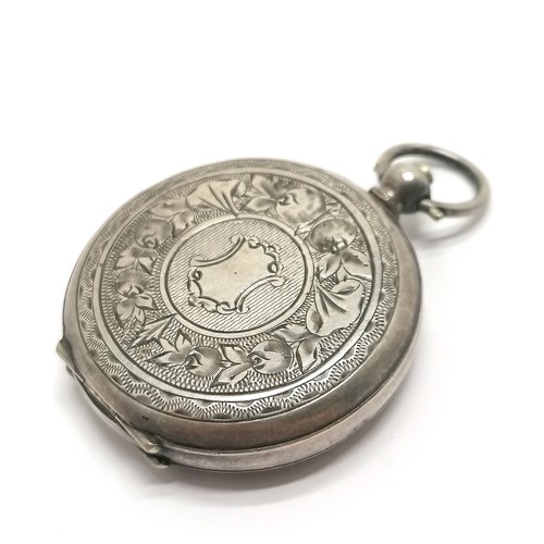 803 - Antique silver cased ladies fob watch 35mm case with engraved detail - running at time of listing bu... 