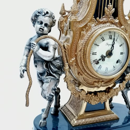 837 - Italian Rococo style clock garniture with cherub with cloven hoof detail in gilt & silvered metal wi... 