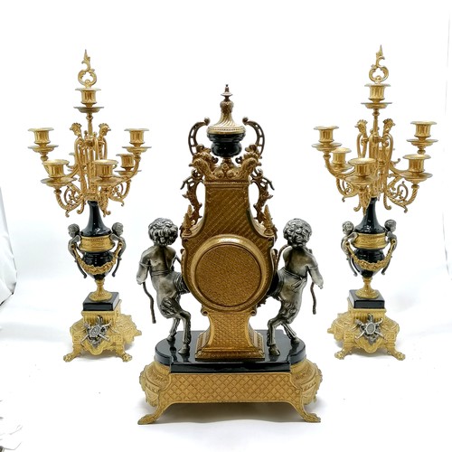 837 - Italian Rococo style clock garniture with cherub with cloven hoof detail in gilt & silvered metal wi... 