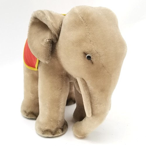 116 - 1950's Steiff grey elephant with a red and yellow felt saddle with original paper label  34cm high x... 