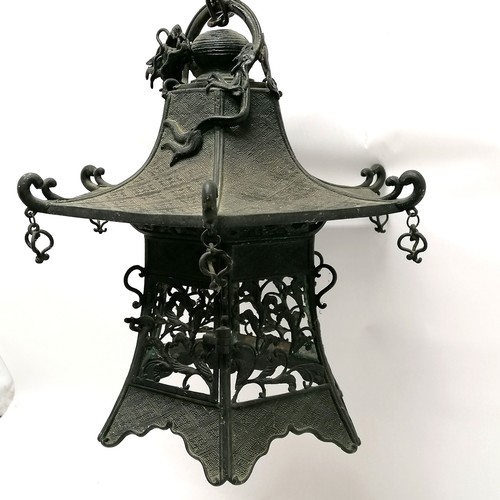 149 - Antique Chinese bronze hanging lantern in the form of a pagoda with dragon detail to top and has ope... 