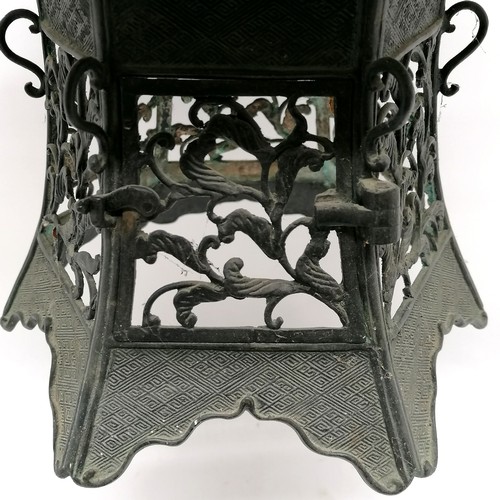 149 - Antique Chinese bronze hanging lantern in the form of a pagoda with dragon detail to top and has ope... 