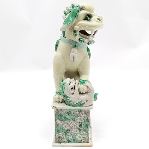 151 - Antique Chinese fo dog (with baby) figure on floral decorated plinth - 31cm high ~ chip to base and ... 