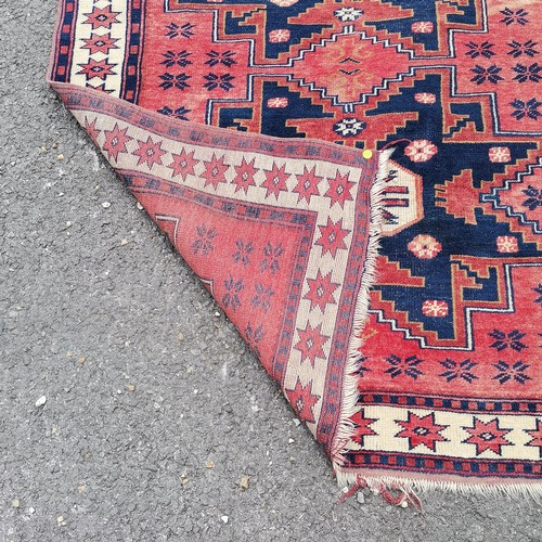 161 - Turkish hand woven wool rug with blue and red geometric design star border - 185cm x 109cm - has sig... 