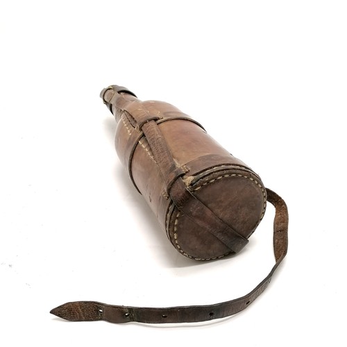 226 - Antique military campaign leather covered bottle with carry handle - 33cm high & missing 1 strap to ... 